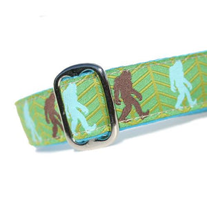 Brown and Turquoise Bigfoot Sasquatch over Green Background Dog Collar Slanted